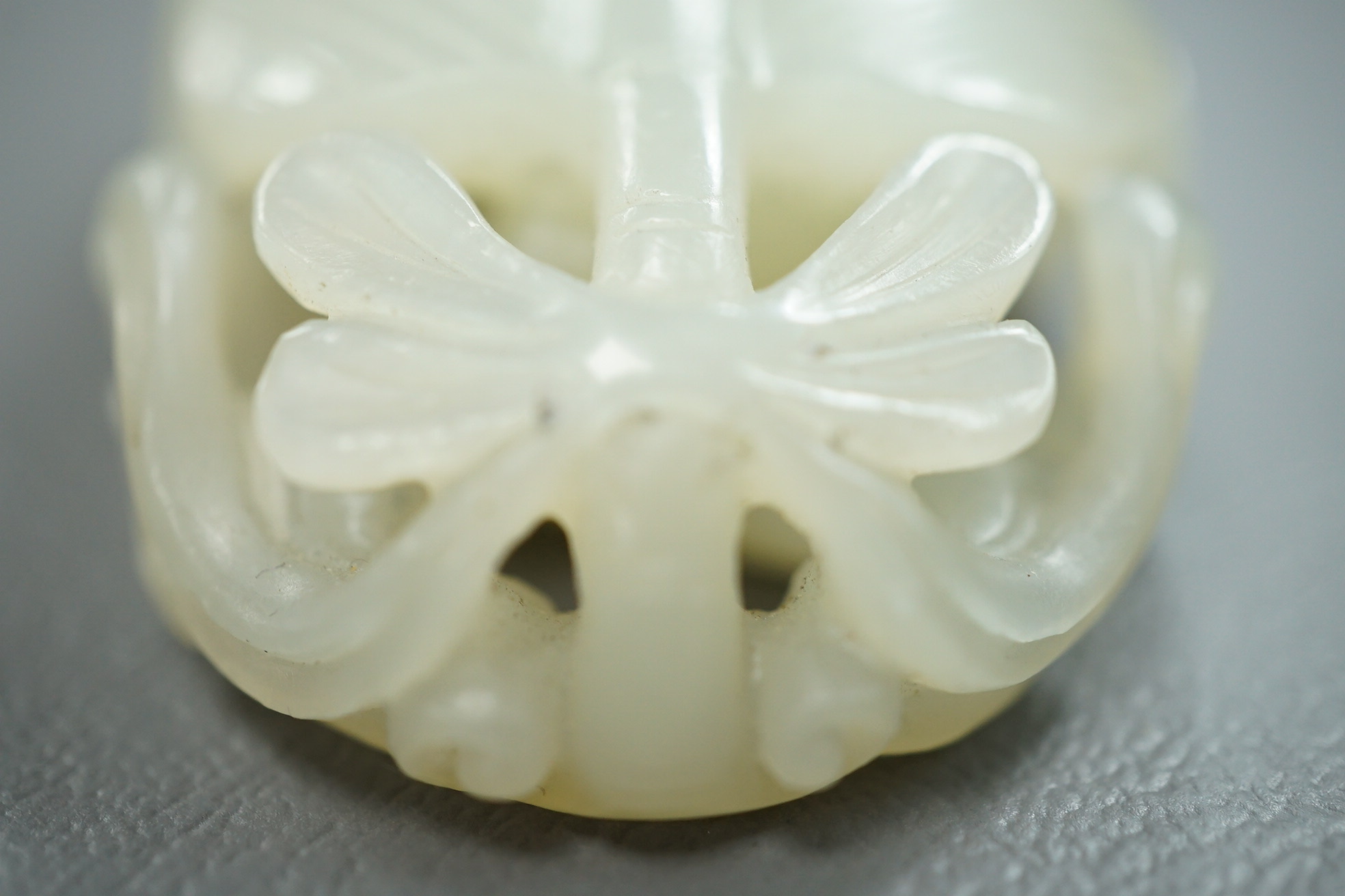 A Chinese pale celadon jade carving of Sun Wukong, the Monkey King, 18th/19th century